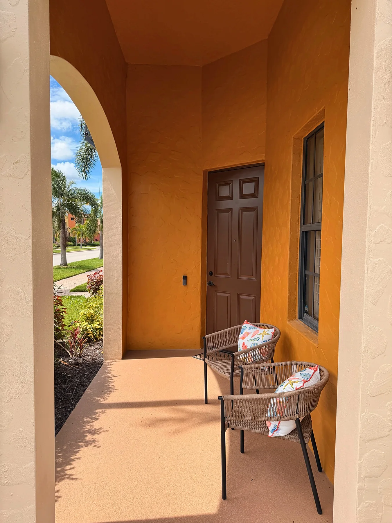 Covered front porch with two chairs